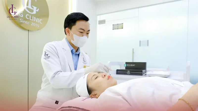 A specialist carrying out a laser treatment on a client in the clinic