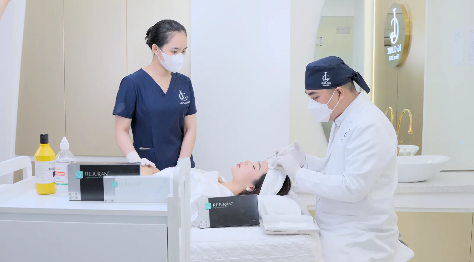 Kylie Tran and a staff member preparing a regenerative skin treatment in the clinic